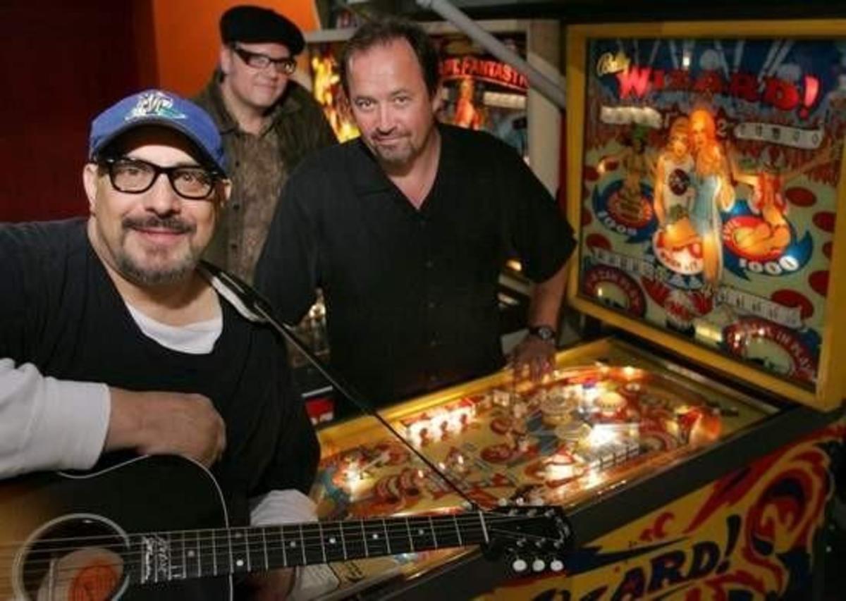  Pat DiNizio (foreground) with Smithereens bandmates Jim Babjak and Dennis Diken (in back)