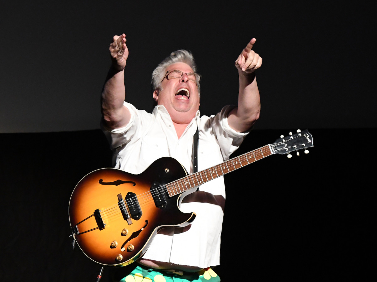 Mojo Nixon gestures to the State Theater audience following a screening of “The Mojo Manifesto: The Life and Times of Mojo Nixon.” (Photo by Chris M. Junior)