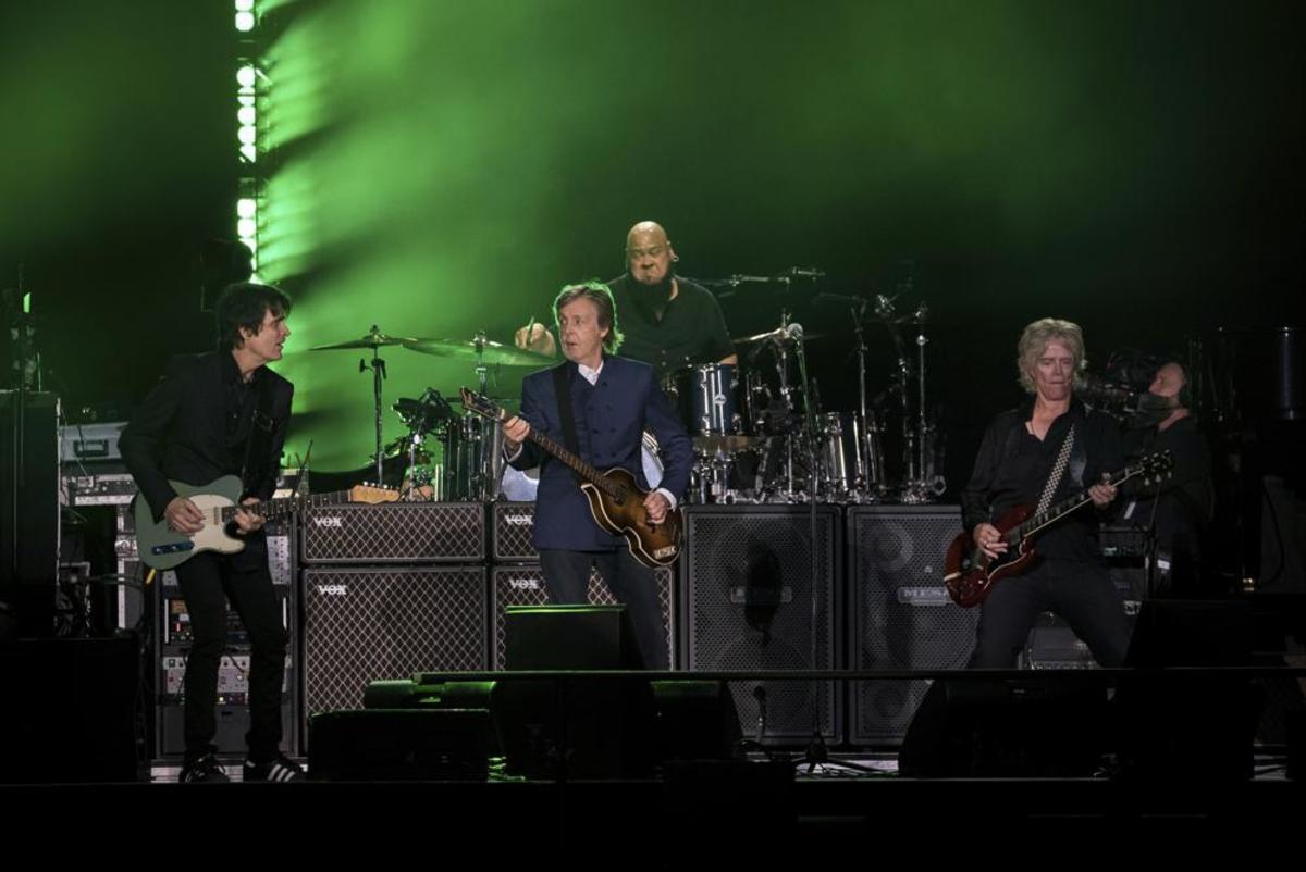 Guitarists Rusty Anderson (left) and Brian Ray flank Paul McCartney in the foreground with drummer Abe Laboriel Jr. behind them at McCartney’s show on Thursday, June 16th at MetLife Stadium in East Rutherford, NJ. (Photo by Christopher Smith/Invision/AP)