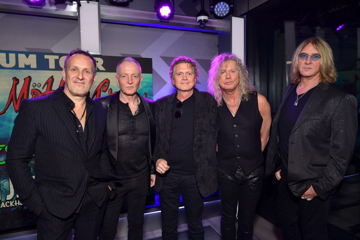 Def Leppard (L-R, Vivian Campbell, Phil Collen, Rick Allen, Rick Savage, and Joe Elliott) speak during the press conference for THE STADIUM TOUR DEF LEPPARD - MOTLEY CRUE - POISON at SiriusXM Studios in Los Angeles, California. (Photo by Emma McIntyre/Getty Images for SiriusXM)
