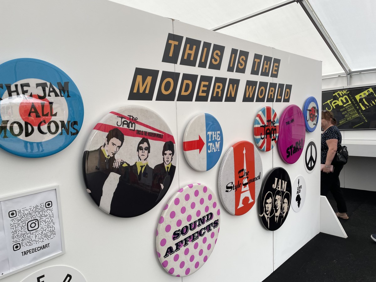 The wall of Jam and Style Council badges near the entrance to the exhibition. (Photo by John Curley)